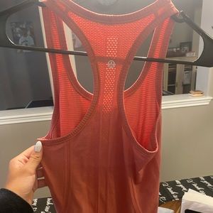 Coral colored lululemon razor back tank top